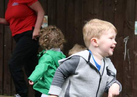 nursery-children-enjoying-playing-outside